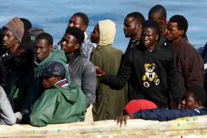A Spanish Coast Guard vessel tows a fibreglass boat with migrants onboard to the port of Arguineguin, on the island of Gran Canaria, Spain, December 25, 2024. REUTERS/Borja Suarez