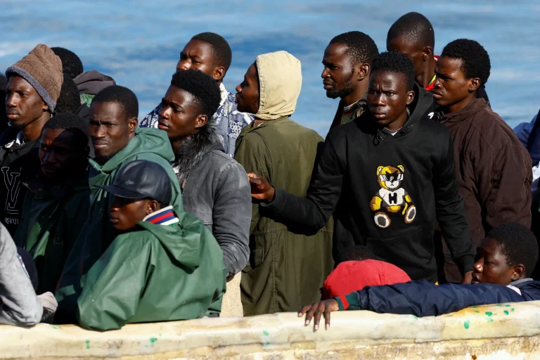 A Spanish Coast Guard vessel tows a fibreglass boat with migrants onboard to the port of Arguineguin, on the island of Gran Canaria, Spain, December 25, 2024. REUTERS/Borja Suarez