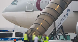 Airport scene showing Afghan deportation flight from Germany