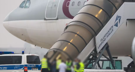 Airport scene showing Afghan deportation flight from Germany