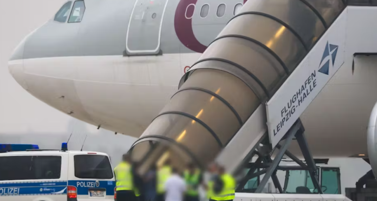 Airport scene showing Afghan deportation flight from Germany